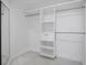 Bright, organized walk-in closet with custom shelving and hanging rods for ample storage at 17657 Windy Pine St, Montverde, FL 34756