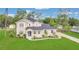 Charming home featuring a manicured lawn, complemented by fresh landscaping and an inviting entrance at 17657 Windy Pine St, Montverde, FL 34756
