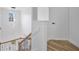Elegant staircase featuring wood and iron railings, with natural light at 17657 Windy Pine St, Montverde, FL 34756