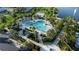 Expansive aerial view of a resort-style pool area with tropical landscaping and ample seating at 1836 Sandy Park Trl, Kissimmee, FL 34747