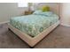 Comfortable bedroom with plush carpet, soft headboard and calming blue and green comforter at 1836 Sandy Park Trl, Kissimmee, FL 34747