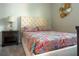 Comfortable bedroom with plush carpet, upholstered headboard and designer bedding at 1836 Sandy Park Trl, Kissimmee, FL 34747