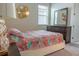 Comfortable bedroom with plush carpet, dresser and designer bedding at 1836 Sandy Park Trl, Kissimmee, FL 34747