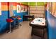Game room with colorful walls, foosball table, air hockey table and bar table set at 1836 Sandy Park Trl, Kissimmee, FL 34747