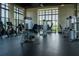 Well-equipped gym with state-of-the-art exercise machines and ample natural light at 1836 Sandy Park Trl, Kissimmee, FL 34747