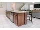 Bright and airy kitchen featuring a spacious island, stainless steel appliances, and a seamless transition to the living space at 1836 Sandy Park Trl, Kissimmee, FL 34747