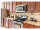 Well-equipped kitchen features stainless steel appliances and a functional layout for culinary enthusiasts at 1836 Sandy Park Trl, Kissimmee, FL 34747