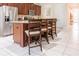 Well-appointed kitchen island with bar seating, stainless steel appliances, and a seamless transition to the open floor plan at 1836 Sandy Park Trl, Kissimmee, FL 34747