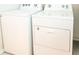 Laundry room with white Whirlpool washer and dryer at 1836 Sandy Park Trl, Kissimmee, FL 34747