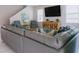 Spacious living room featuring a large sofa, TV, and decor, creating a cozy atmosphere at 1836 Sandy Park Trl, Kissimmee, FL 34747