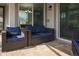 Relaxing patio area with comfortable seating, perfect for outdoor lounging and enjoying the serene surroundings at 1836 Sandy Park Trl, Kissimmee, FL 34747