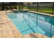 Inviting swimming pool and spa in backyard of home with screened enclosure at 1836 Sandy Park Trl, Kissimmee, FL 34747