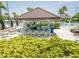 Poolside bar with ample seating and lush landscaping, enhancing outdoor experiences at 1836 Sandy Park Trl, Kissimmee, FL 34747