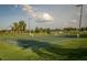Scenic sport court with basketball and soccer goals, surrounded by lush green landscaping at 1836 Sandy Park Trl, Kissimmee, FL 34747