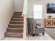 Staircase with carpeted steps leading to the next level of the home at 1836 Sandy Park Trl, Kissimmee, FL 34747