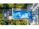 Aerial view of the community's wave pool, surrounded by seating and lush tropical landscaping at 1836 Sandy Park Trl, Kissimmee, FL 34747