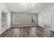 Bedroom with abundant natural light, wood-look floors, and ensuite bath access at 2085 Friar Tuck Ln, Orange City, FL 32763