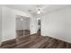 Bright bedroom with a ceiling fan, wood floors, and mirrored closet doors at 2085 Friar Tuck Ln, Orange City, FL 32763