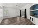 Spacious living room featuring natural light and a built-in entertainment center at 2085 Friar Tuck Ln, Orange City, FL 32763