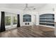 Inviting living area with built-in storage and adjacent screened patio entrance at 2085 Friar Tuck Ln, Orange City, FL 32763