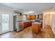 Spacious kitchen featuring stainless steel appliances, granite countertops, and a central island at 2311 Olivet Ave, Leesburg, FL 34748