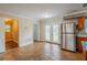Bright kitchen with stainless steel refrigerator and easy access to the backyard through french doors at 2311 Olivet Ave, Leesburg, FL 34748