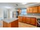 Beautiful kitchen features granite counters, stainless appliances, and a stylish mosaic backsplash at 2311 Olivet Ave, Leesburg, FL 34748