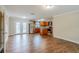 Open-concept kitchen and dining area featuring stainless steel appliances and a center island at 2311 Olivet Ave, Leesburg, FL 34748