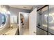 Modern bathroom featuring updated lighting, vanity, and a glass-enclosed shower at 2506 Shelby Cir, Kissimmee, FL 34743