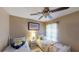 Cozy bedroom featuring twin beds, soft lighting, and a calming atmosphere at 2506 Shelby Cir, Kissimmee, FL 34743