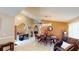 Open-concept dining room featuring modern lighting and decor, connected to living spaces at 2506 Shelby Cir, Kissimmee, FL 34743