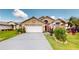 Charming single Gathering home boasting a well-manicured lawn and two car garage at 2506 Shelby Cir, Kissimmee, FL 34743