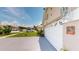 Well-maintained home exterior with a spacious driveway, landscaped yard, and attached garage at 2506 Shelby Cir, Kissimmee, FL 34743