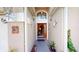 Charming front entrance featuring a decorative door, detailed facade, and landscaping at 2506 Shelby Cir, Kissimmee, FL 34743