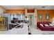 Modern kitchen featuring a breakfast bar, stainless steel appliances, and ample counter space at 2506 Shelby Cir, Kissimmee, FL 34743