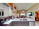 Open kitchen with stone countertops overlooking the living room, perfect for entertaining at 2506 Shelby Cir, Kissimmee, FL 34743