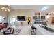 Bright living room featuring sliding door access to the outdoor area and an open flow to the kitchen at 2506 Shelby Cir, Kissimmee, FL 34743