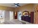 Bright main bedroom with closet, dresser and connected bath and kitchen at 2506 Shelby Cir, Kissimmee, FL 34743