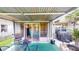 Covered patio featuring outdoor seating and view of the enclosed sunroom at 2506 Shelby Cir, Kissimmee, FL 34743
