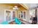 Outdoor patio featuring tile flooring, ceiling fan, and comfortable seating area at 2506 Shelby Cir, Kissimmee, FL 34743