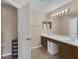 Bathroom with a double vanity, white countertops, and tiled floors at 2963 Beckwith St, Deltona, FL 32738