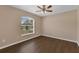 Bedroom with hardwood floors and natural light from the large window at 2963 Beckwith St, Deltona, FL 32738