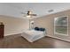 An empty bedroom is bright with neutral paint and hardwood floors at 2963 Beckwith St, Deltona, FL 32738