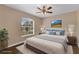 Bedroom with a large window and hardwood floors, bathed in natural light at 2963 Beckwith St, Deltona, FL 32738