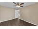 Bedroom featuring hardwood floors, a ceiling fan, and a doorway leading to other rooms at 2963 Beckwith St, Deltona, FL 32738
