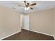 Bedroom featuring hardwood floors, a ceiling fan, and a doorway leading to other rooms at 2963 Beckwith St, Deltona, FL 32738