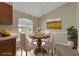 Dining room featuring a round table with chairs, a window, and a nature painting at 2963 Beckwith St, Deltona, FL 32738