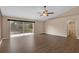 Expansive living room showcasing sliding glass door, hardwood floors, and natural light at 2963 Beckwith St, Deltona, FL 32738