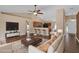 Open-concept living room with vaulted ceilings, hardwood floors, and neutral color palette at 2963 Beckwith St, Deltona, FL 32738