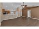 Open floor plan highlighting wood flooring with neutral wall colors and vaulted ceiling at 2963 Beckwith St, Deltona, FL 32738